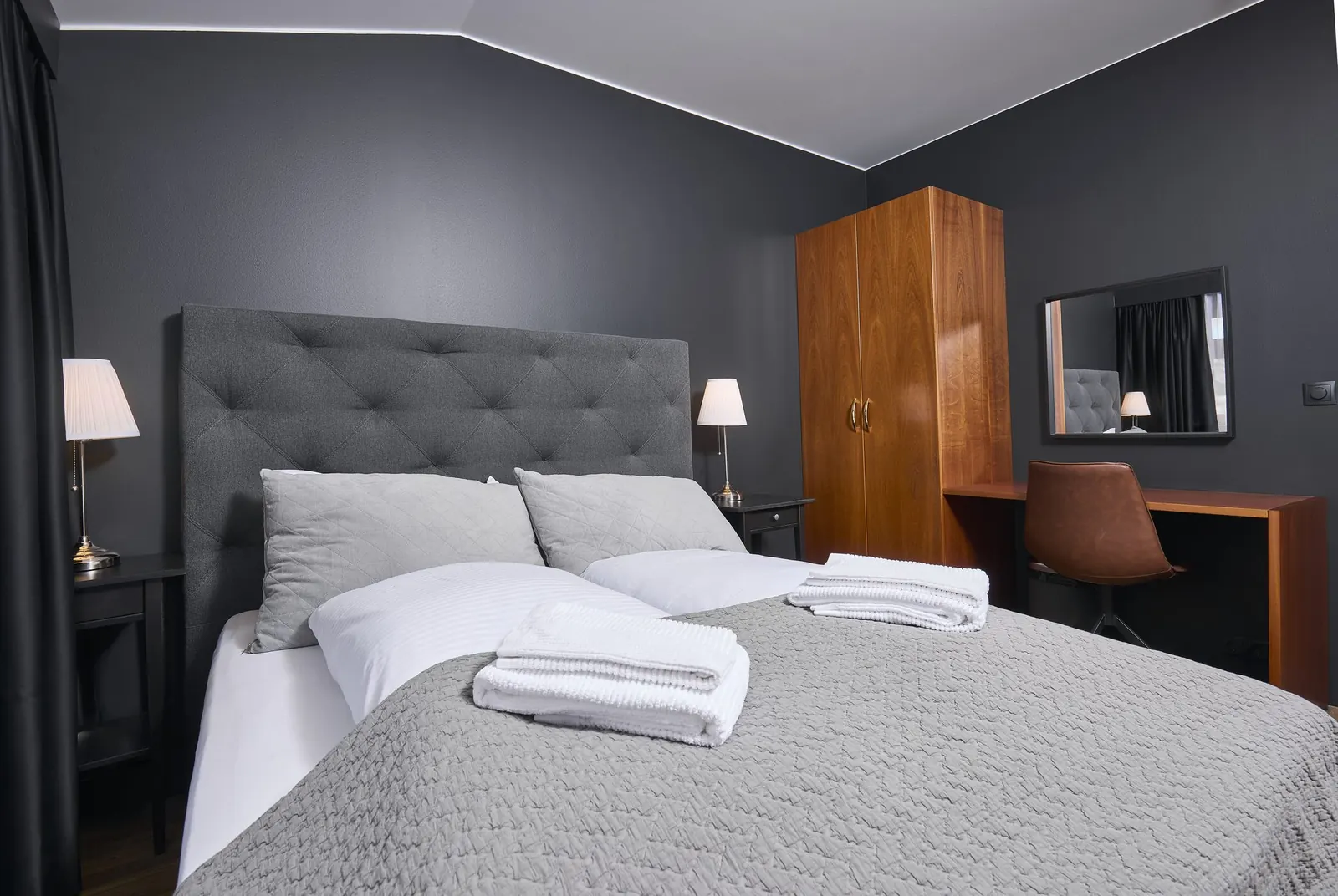 Standard Room: bed, desk and wardrobe