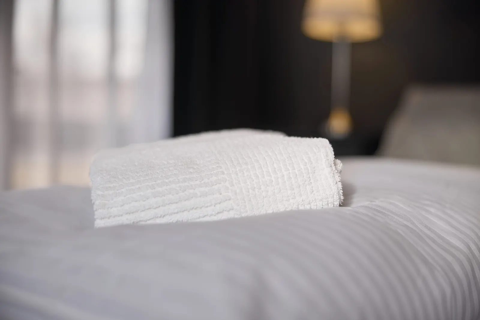 Fresh towels on the bed